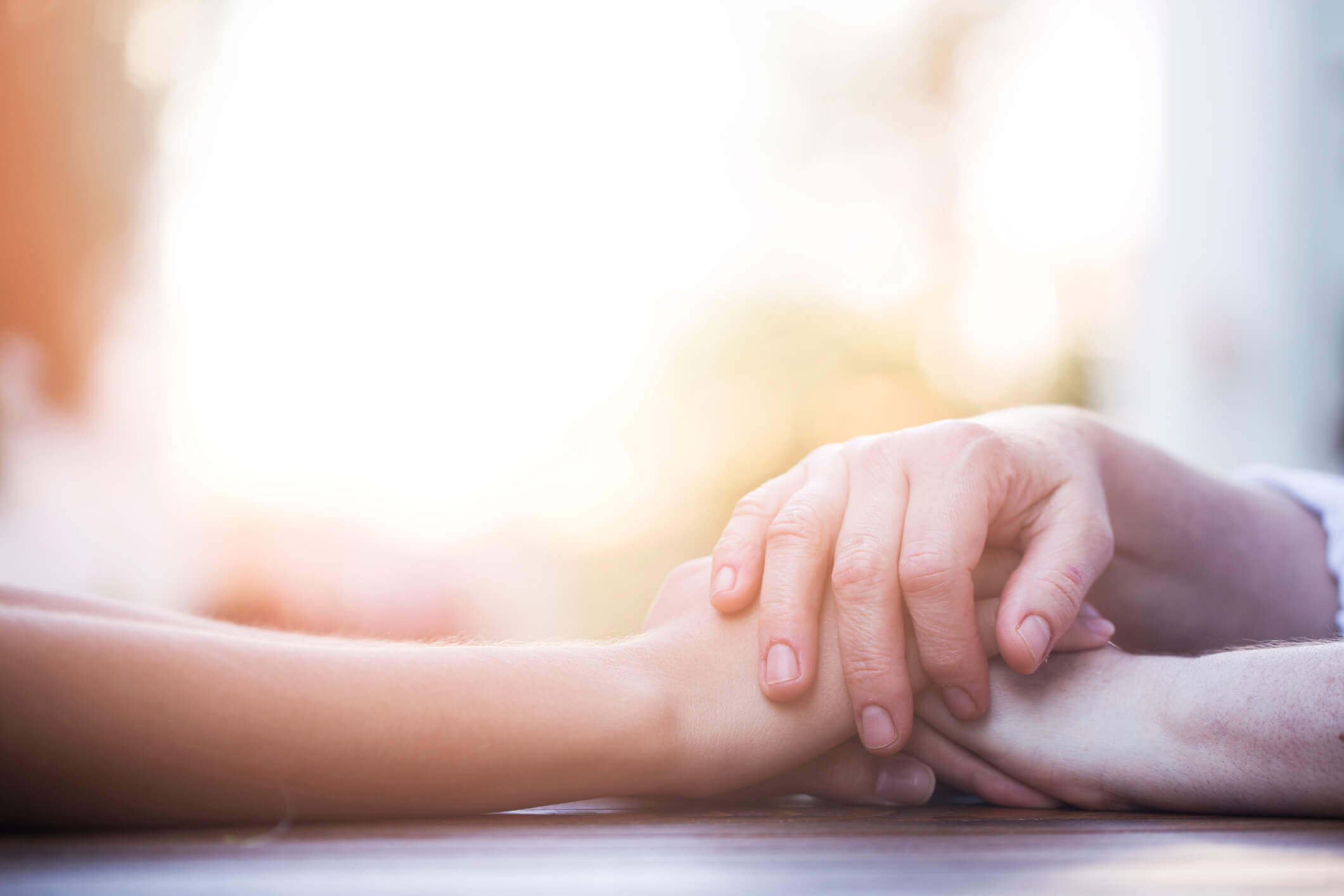 Chaplain services holding hands