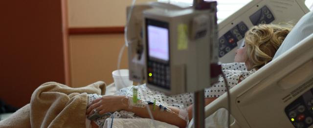 Woman in hospital bed 