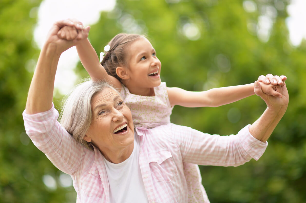 Woman and kid playing outside